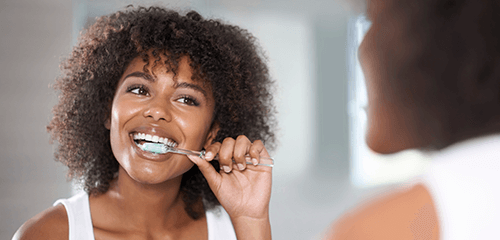 Woman brushing teeth